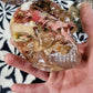 Pink resin skull encapsulation as modern home décor with natural elements